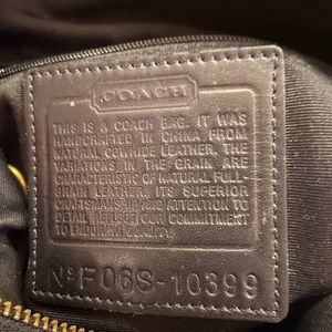 Coach cross body purse; black leather.